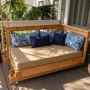 Custom outdoor cushions tailored for a water-resistant backyard daybed and luxury garden lounger.