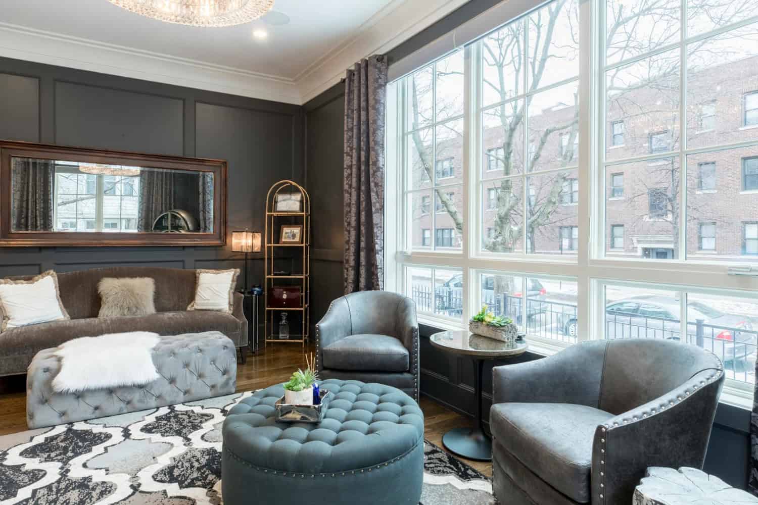Elegant living room with U-shaped sectional sofa and round ottoman