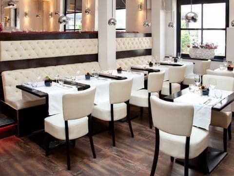 Custom cushions for bench and chair seating at restaurant