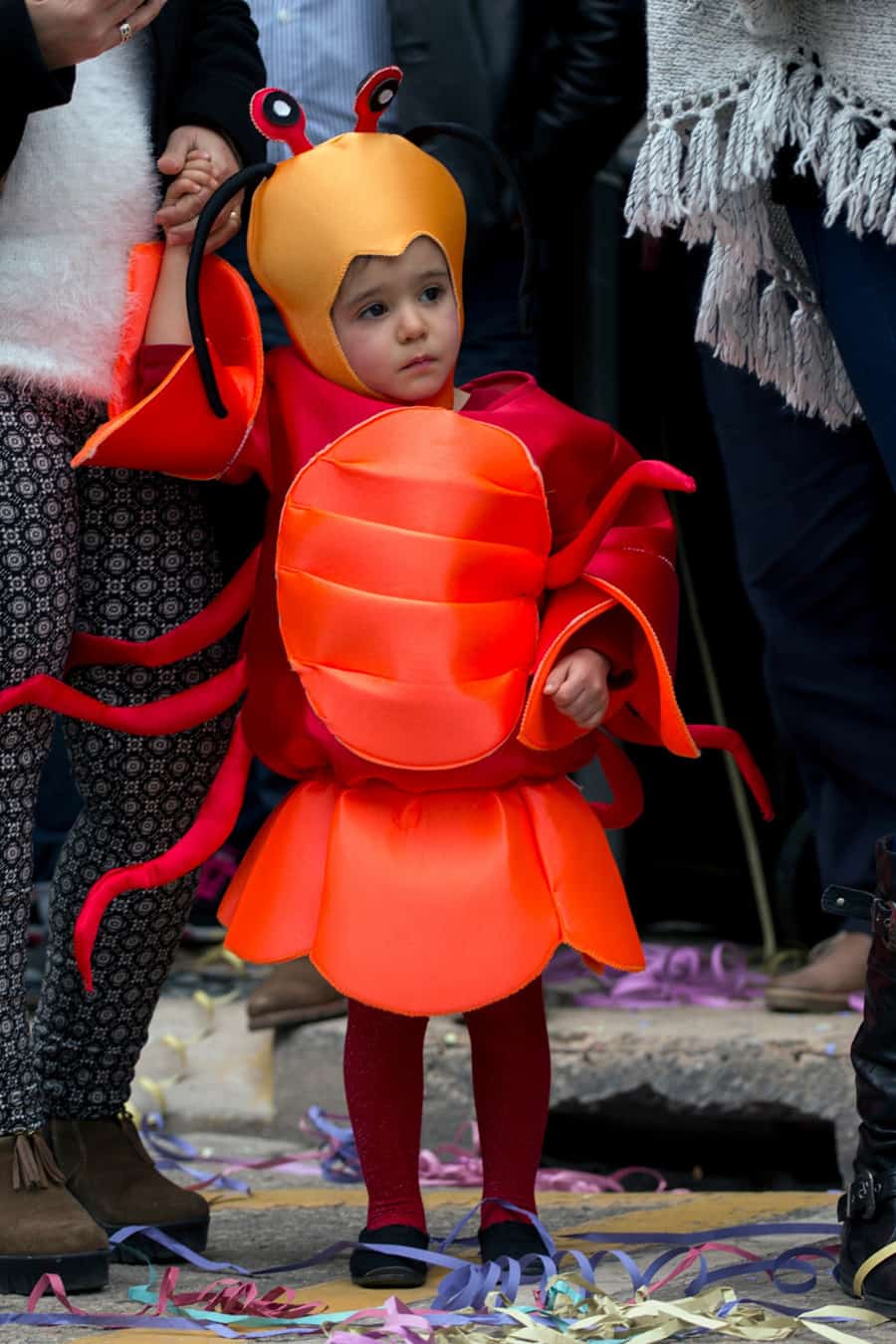 Child wearing a lobster costume made from closed cell foam.