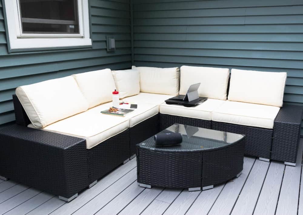 An outdoor deck with a couch and coffee table