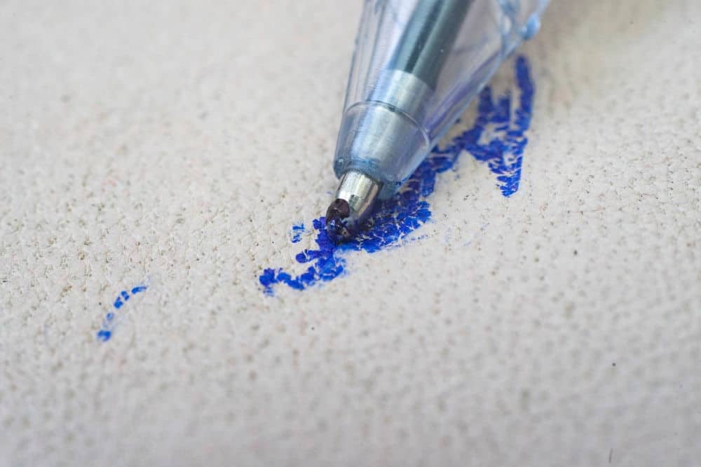 Cushion fabric with blue pen stains