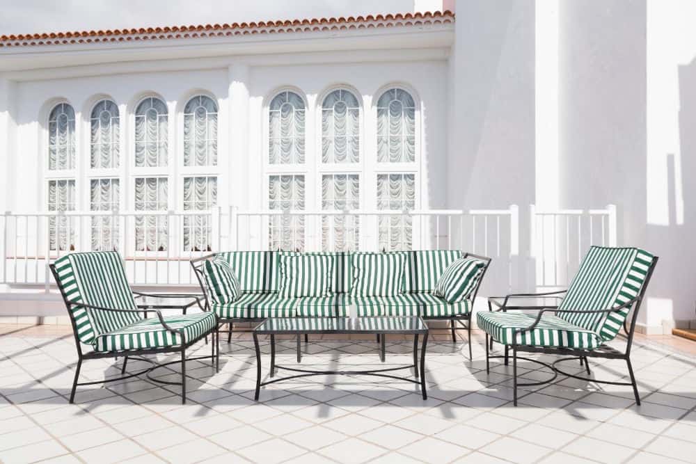 A group of chairs and a table on a patio