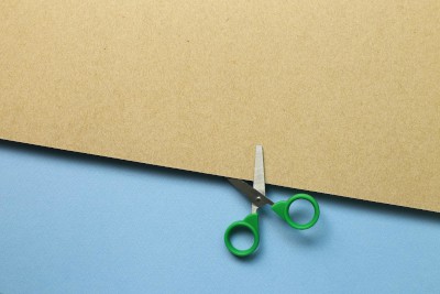 Scissors cutting through paper