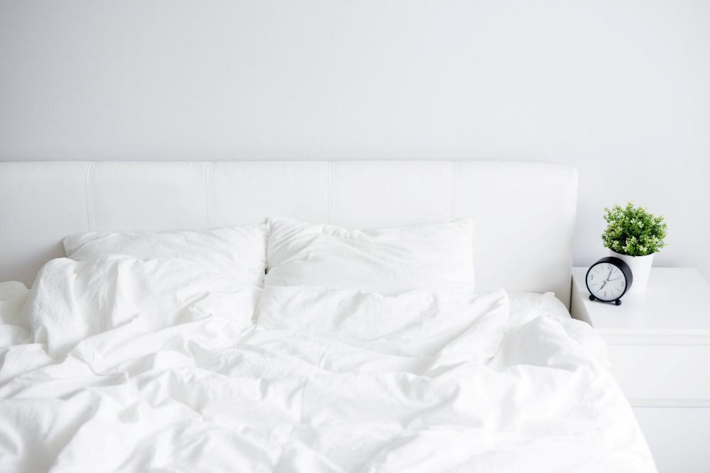 White bed with white sheets and pillows