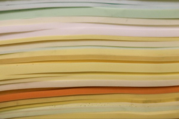 A stack of open cell and closed cell foam sheets