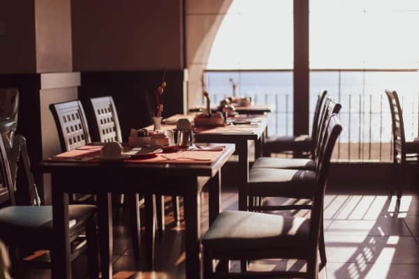 Dining room with chairs with cushions and tables