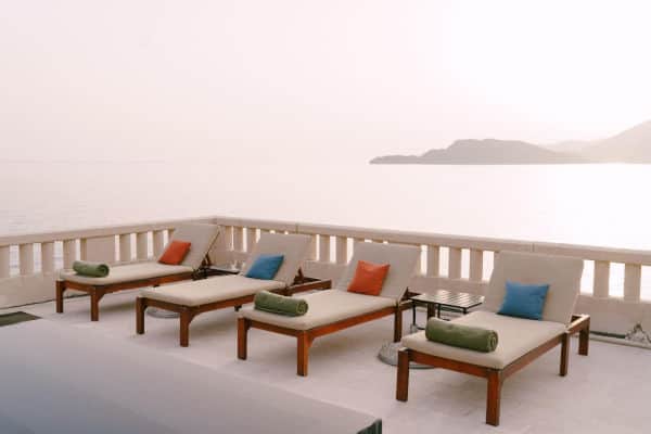 Outdoor lounge chair cushions at a seaside resort