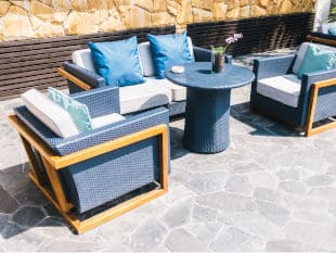 Ashely Outdoor furniture set in a backyard patio area with new replacement custom cushions