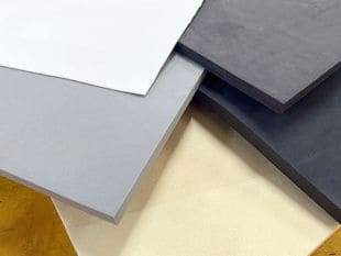 Black, white, and various shades of grey sheets of closed cell foam