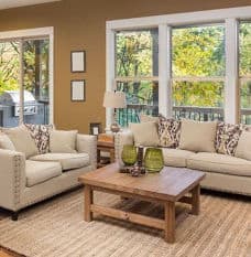 Clean and Bright Living Room with Couch and Chairs