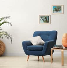 Blue Chair with Cushion and Books on the Table