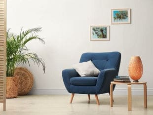 Blue Chair with Cushion and Books on the Table