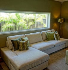 Gray Couch featuring a custom L shape chaise cushion