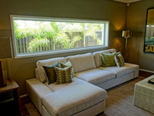 Gray Couch featuring a custom L shape chaise cushion