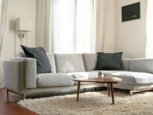 Gray modern Couch with square shaped seat and back cushions