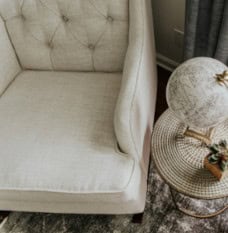 Overhead image of arm chair showcasing T-shape cushion