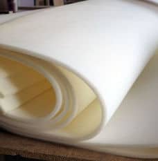 Thin white foam sheets rolled up in layers