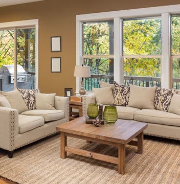Clean and Bright Living Room with Couch and Chairs