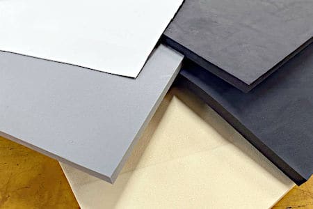 Black, white, and various shades of grey sheets of closed cell foam