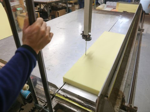Foam being custom cut on a large foam saw