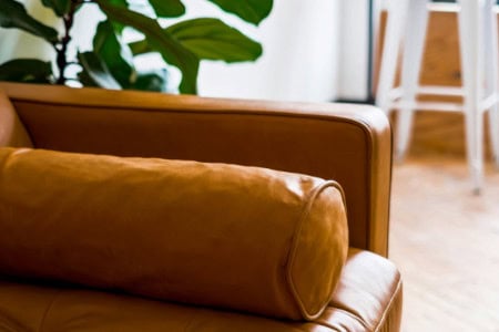 Cylinder cushion as a decorative pillow on couch