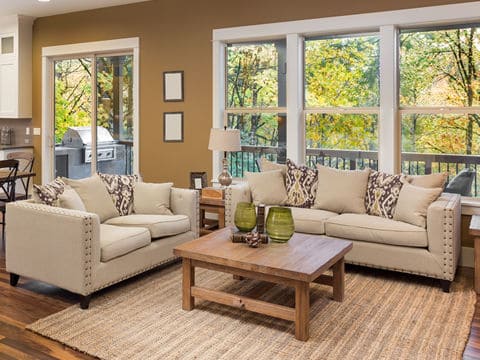 Clean and Bright Living Room with Couch and Chairs