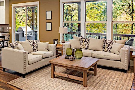 Clean and Bright Living Room with Couch and Chairs