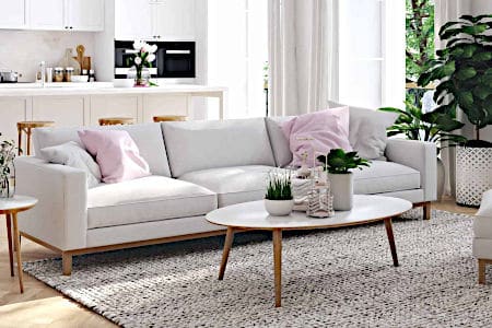 White Couch and Tables with Plants in Room