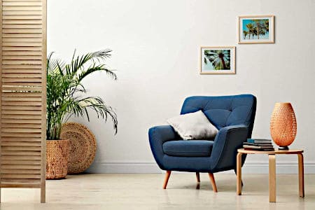 Blue Chair with Cushion and Books on the Table