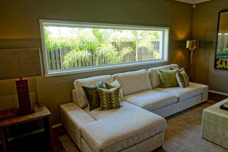 Gray Couch featuring a custom L shape chaise cushion