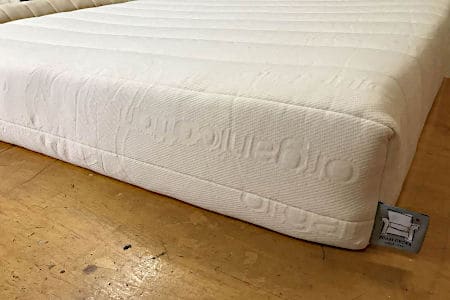 White Latex Mattress on Brown Floor