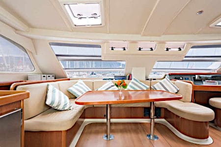 Custom circular boat cushions at a table on a large boat