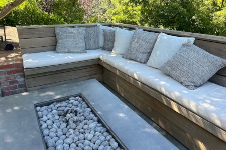 Custom Outdoor Cushion Seating and Pillows Around Outdoor Fireplace
