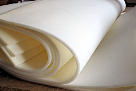 Thin white foam sheets rolled up in layers