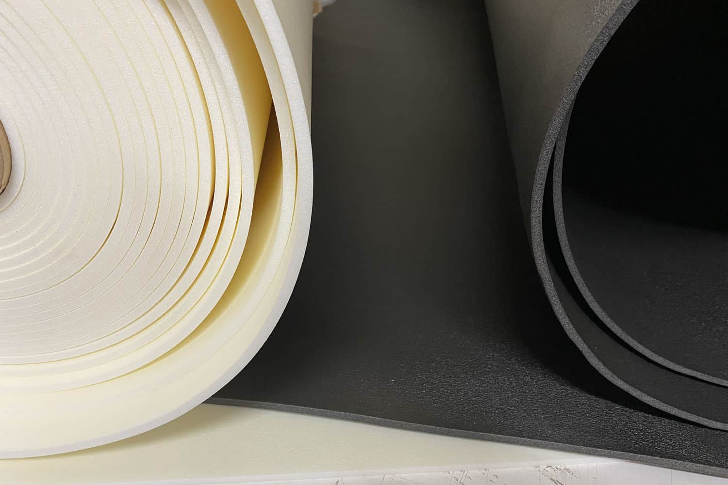 White and black rolls of Volara foam